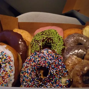 A dozen glorious donuts minus 3 holes that my son has already eaten