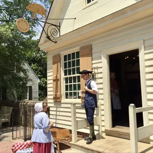 a man standing outside of a house