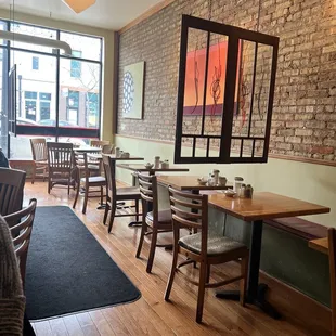 a dining area with tables and chairs