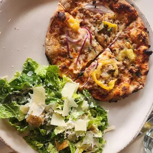 Spicy Sicilian pizza and side caesar salad