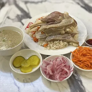 Deluxe Meal: Double Lamb Ribs &amp; Lamb Shank Served On Carrot Rice w/Pickled Onions, Carrots, Pickles, Soup &amp; Chili Oil | $27.99