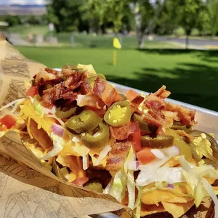 A quick pick-me-up for a day out on the green- loaded nachos!