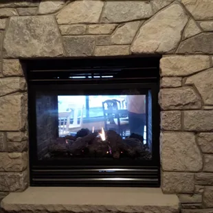 I love the addition of a fireplace to the new location