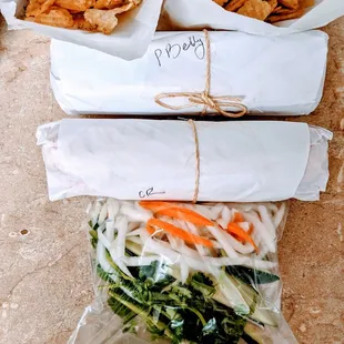 Takeaways packaging; ask for separated condiments to prevent soggy sandwiches.