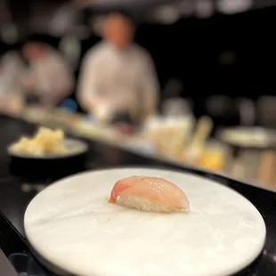 a plate of sushi on a counter