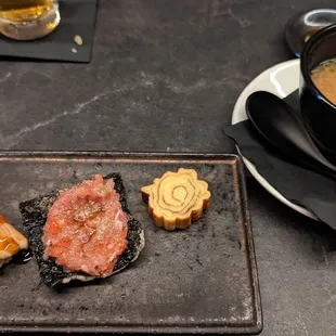 Tender eel, spicy toro on a crunchy seaweed chip, and something sweet.  The miso soup is excellent, and should be eaten with the toro chip