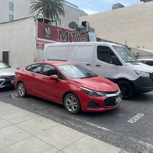 Restaurants van hiding sign that says parking is not for restaurant.