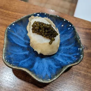 Scallop topped with caviar