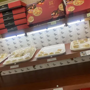 Pineapple pastries singles in middle, boxed ones on top.