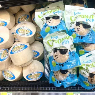 a display of coconuts in a grocery store