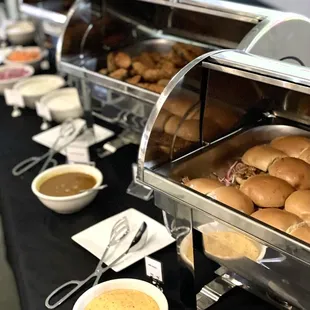 a variety of food items on a buffet table