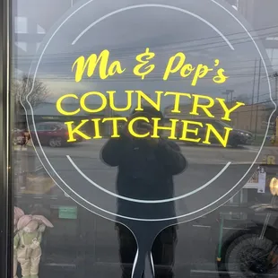 the reflection of a person in the window