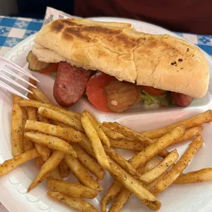 Sausage po-boy with a side of fries
