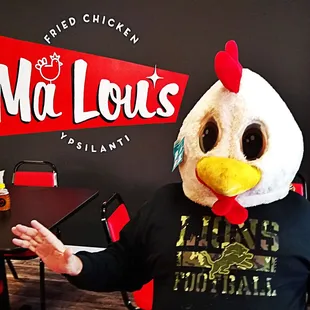 a man in a chicken mask