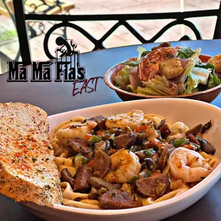 a bowl of pasta and a bowl of salad