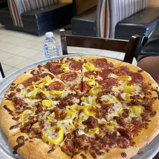 Half pepperoni half sausage pizza