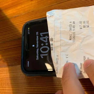 a receipt being taken out of a cell phone