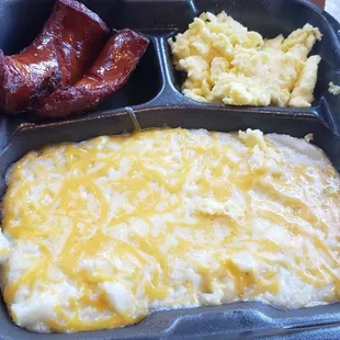 Grits with cheese, scrambled egg smoked sausage