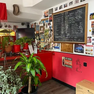 ows a restaurant counter with a chalkboard on the wall