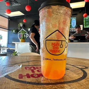 a glass of iced tea on a table