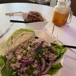 Larb gai, brown rice, and a Thai ice tea with whipped cream