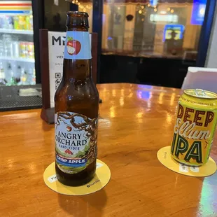 a beer and a can on a table