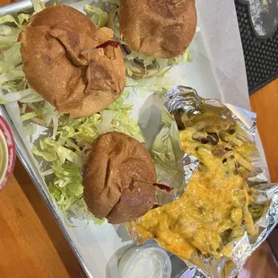 a tray of sandwiches and a side of fries