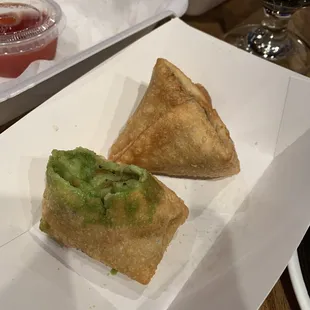 Samosa with green sauce.