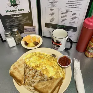 Veggie omelette with hash browns, toast and a side of fruit
