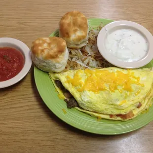 Wild Hog Omelet! Ham, Bacon, &amp; Sausage hash browns biscuits and gravy.