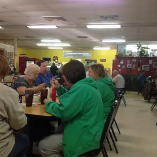 a group of people sitting at a table