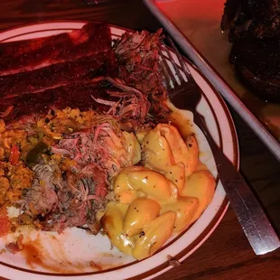 Pork ribs , Brisket , Pulled Pork,  Shells with cheese , Brisket rice.
