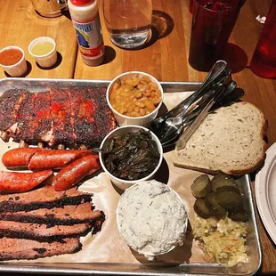 Half rack ribs, kielbasa, brisket, baked beans, hot greens, potato salad. We also took the big pig sandwich to go.