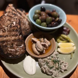 Chef&apos;s Tasting Menu - Course 1: Olives, Mussels escabeche, Dates, Swordfish spread, aioli, toasted breads