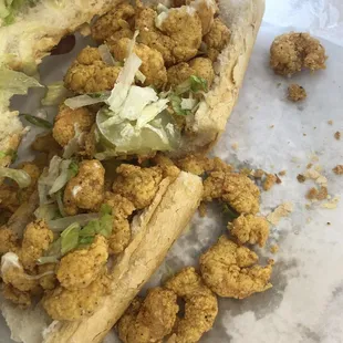 a chicken sandwich with lettuce