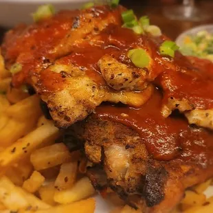 Special of the day: ribs and grilled chicken over a bed of fries, with a side of kale and brussels salad.