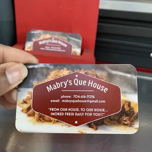 a person holding a business card