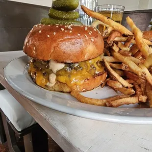 Smash double cheeseburger, cheddar, tomato onion jam, trinity sauce, fries.