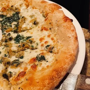 a cheese and spinach pizza