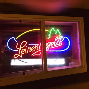 a neon sign in a window