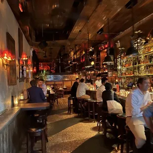 people sitting at tables in a restaurant