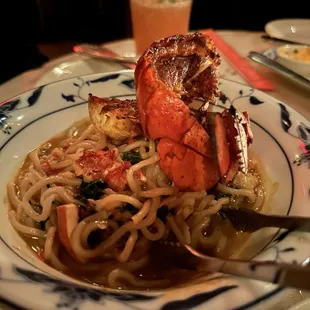 Lobster Noodles are Ramen style in a broth. I don&apos;t like that I had to take the meat out of the shell myself for $48 but flavor was good.