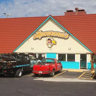 cars parked in front of a restaurant