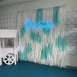 a play area with a neon sign