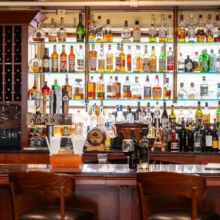 a bar with many bottles of alcohol