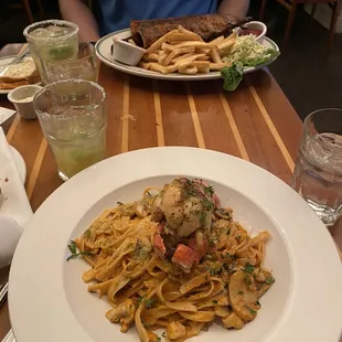 Lobster and scallop pasta and the ribs, chicken, sausage combo that also comes w fries and coleslaw