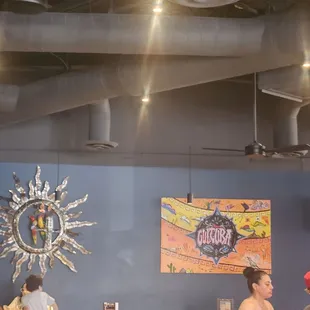 people sitting at tables in a restaurant