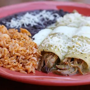 a plate of rice, beans, and meat