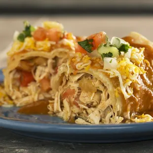 a burrito on a blue plate