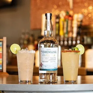 three cocktails on a bar